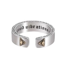 Detailed close-up of adjustable stainless steel ring with All-Seeing Eye and engraving