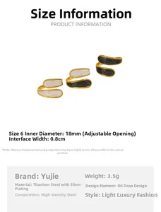 Detail view of gold titanium steel rings with black and white drip oil stream design