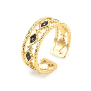 Detailed macro view of golden twisted-rope adjustable ring with black enamel diamonds
