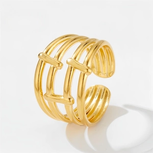 Close-up of geometric multi-layer hollow gold-plated stainless steel open ring detail