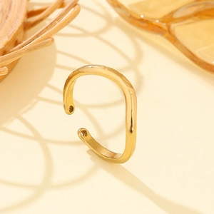 Minimalist gold S-shaped open ring with irregular geometric texture and hollow details