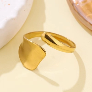 Minimalist adjustable 18K gold plated titanium steel ring with textured wave pattern