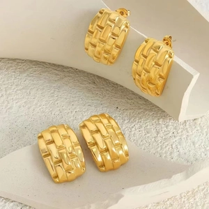 Vintage 18K gold-plated stainless steel earrings with geometric woven texture on white base