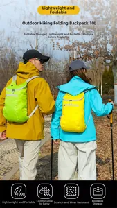 Rear view of hikers wearing 10L lightweight folding waterproof outdoor backpacks