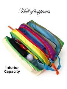 Macro detail of multi-compartment crossbody bag showing internal storage capacity and color blocking