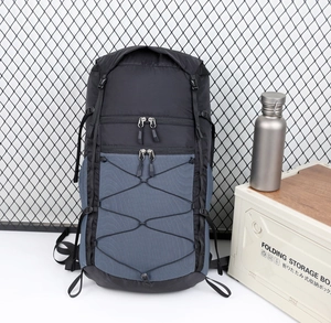 Close-up of hiking backpack with elastic storage system and durable buckle details