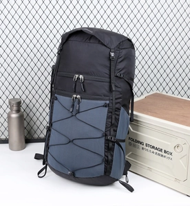 Detailed view of hiking backpack with elastic cord system and durable nylon fabric