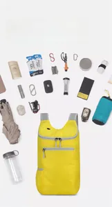 Detailed view of yellow water-resistant folding backpack with high storage capacity