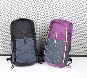 Outdoor hiking backpacks in black and purple featuring front bungee cord system and straps