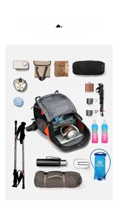 Flat lay of high-capacity hiking backpack organized with camping gear and outdoor equipment