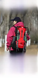 Detail of the 60L hiking backpack showing elastic fixing rope and durable bottom webbing
