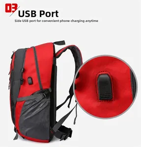 Close-up of the integrated USB charging port on the waterproof red and grey hiking backpack