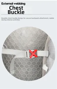 Detail of front chest buckle on cycling backpack with gray webbing and red plastic clip