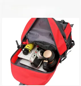 Internal view of a red travel backpack showing large capacity for laptops and gear