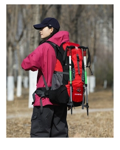 60L large capacity hiking backpack with trekking poles shown in outdoor trail setting
