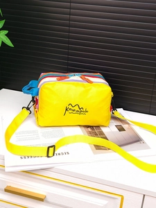 Detailed top view of a colorful waterproof outdoor crossbody bag with dual zippers