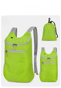 Foldable water-resistant hiking backpack in vibrant green with its compact storage pouch