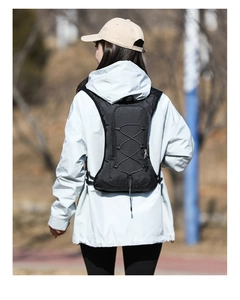 Close-up of black breathable mesh hydration vest with elastic cord for trail running
