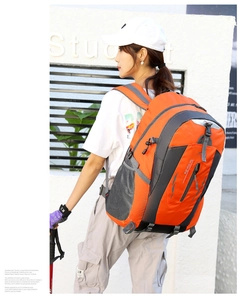 Outdoor waterproof hiking backpack in vibrant orange and grey with multiple zipper pockets