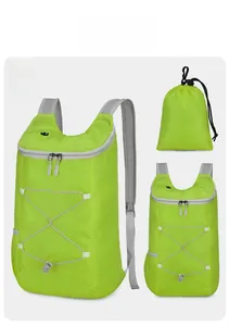 Detailed view of the ultralight green hiking backpack with its compact storage pouch