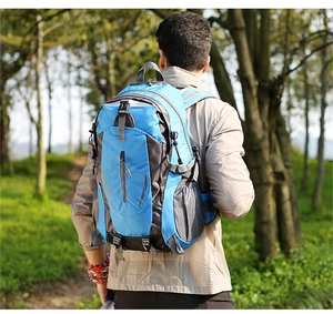 Detail of blue waterproof nylon hiking backpack with grid pattern and side mesh pocket