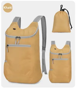 Detail view of khaki foldable backpack showing ripstop texture and mesh straps