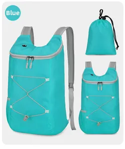 Detail view of foldable blue outdoor backpack with storage pouch and adjustable straps