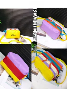 Detail view of colorful water-repellent nylon crossbody bag with multi-zipper pockets