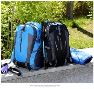 Waterproof nylon hiking backpacks in blue and black with professional trekking poles