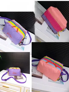 Detailed views of multi-layer waterproof nylon crossbody bag with color-block design