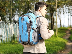 Outdoor hiking backpack in blue and gray with breathable back system and side mesh pockets
