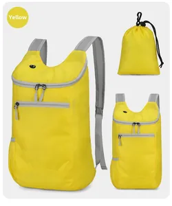 Detail view of yellow lightweight foldable outdoor backpack with breathable mesh straps