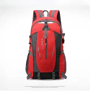 Front view of a red and grey waterproof hiking backpack with reflective strips and mesh pockets