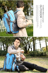 Detail of blue waterproof nylon hiking backpack with side mesh pocket and buckle
