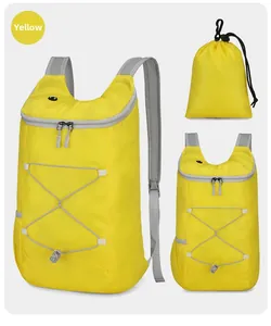 Macro detail of foldable waterproof yellow sports backpack with its compact storage pouch