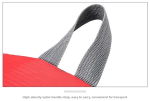 Detail of high-density nylon handle and durable red fabric on waterproof travel backpack