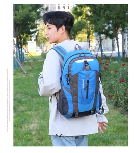 Detailed side view of water-resistant hiking backpack showing compartments and mesh pockets