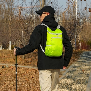 Lightweight foldable waterproof outdoor backpack in bright green for hiking and travel
