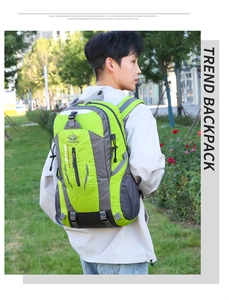 Outdoor backpack detail showing bright green and grey panels with mesh side pockets