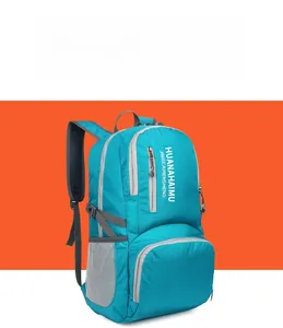 Detailed view of the turquoise foldable travel backpack with spacious compartments