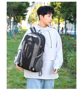 Outdoor black and grey waterproof hiking backpack with VANAHEIMR logo shown on model