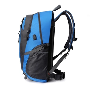 Royal blue waterproof outdoor travel backpack with USB charging port and mesh side pocket