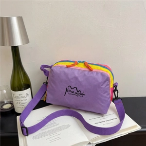 Waterproof nylon crossbody bag in purple, yellow and blue for outdoor hiking travel use