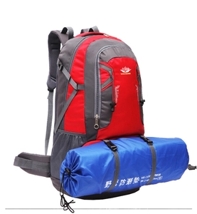 Outdoor hiking backpack detail with ergonomic straps and a blue sleeping mat attached