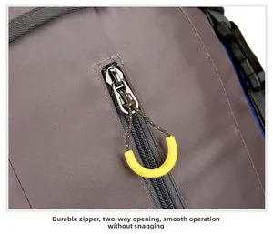 Detail of durable dual-way zippers with yellow non-slip pulls on waterproof hiking backpack