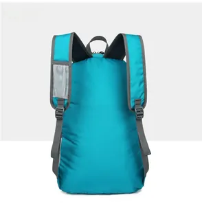 Detail view of lightweight blue backpack with breathable mesh back panel and wide straps