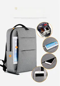 Detailed interior compartments of grey business laptop backpack with waterproof fabric