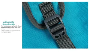 Detail of blue outdoor backpack featuring ripstop nylon fabric and strap adjustment buckle