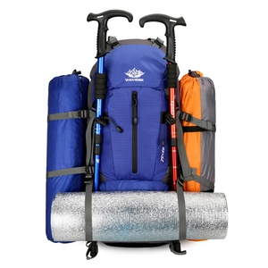 Blue 45+5L hiking backpack with attached trekking poles and camping gear on white background