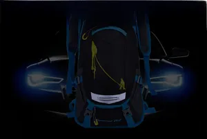 Detail view of high-visibility reflective strip on black 18L cycling backpack for night safety